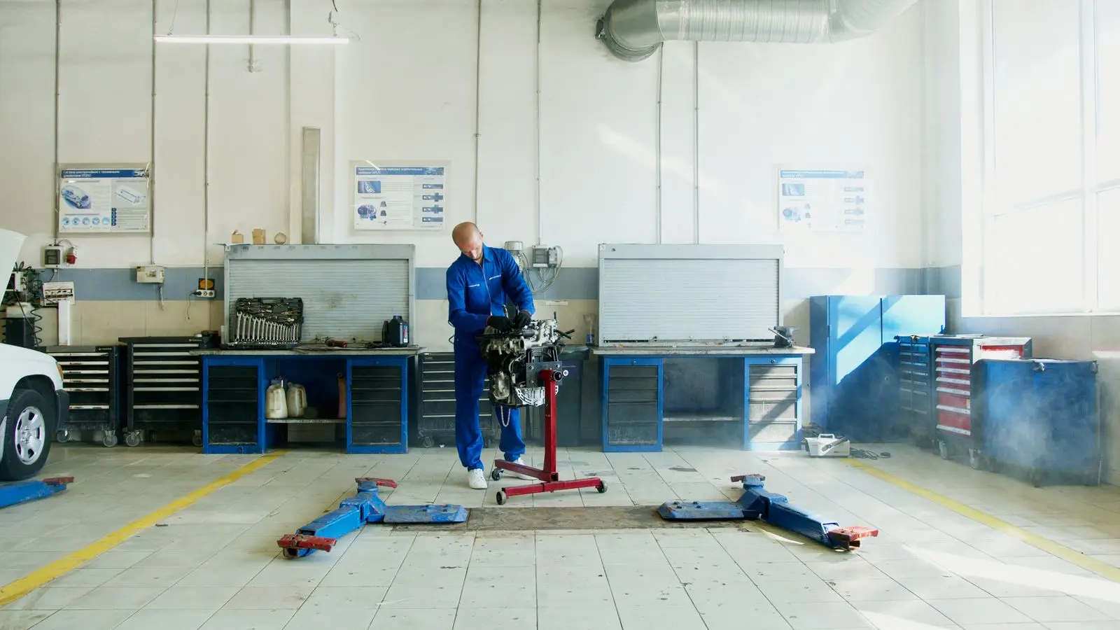 Mechanic working in a bright automotive shop